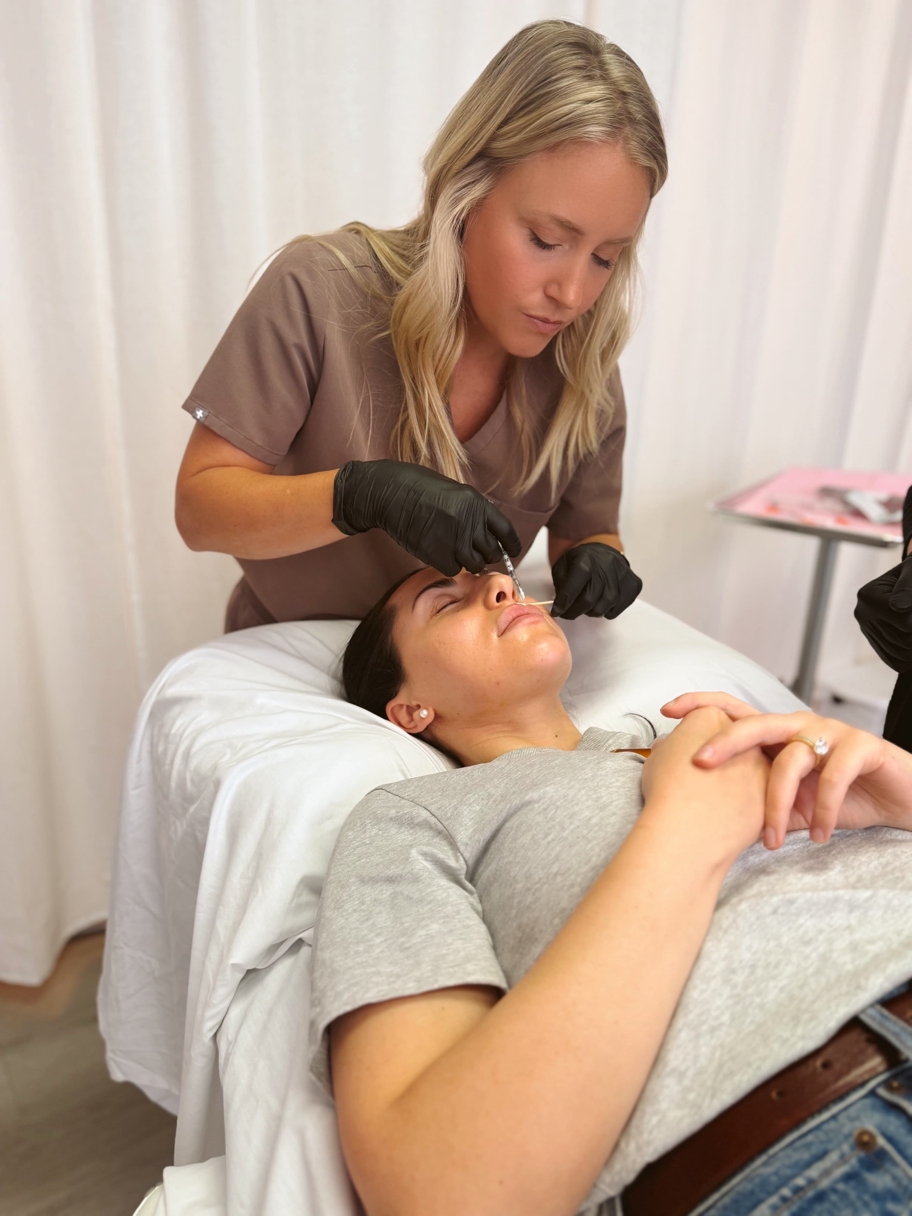 Nurse Jayme carefully administering Botox injections to a client